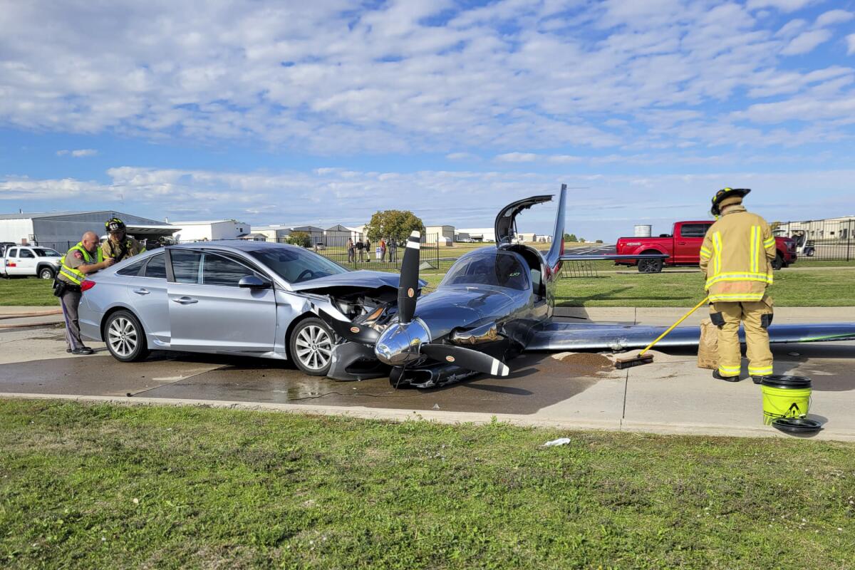 Small plane crashes into car after overshooting runway during